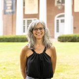 Person wearing glasses smiling