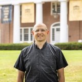 Person wearing glasses smiling