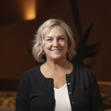 Person standing inside Norton Center lobby