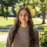 Person smiling at photographer