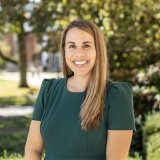 Person smiling at photographer