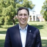 Person smiling at photographer