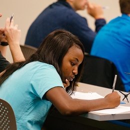 Student taking notes in class