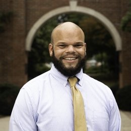 CLAY TAYLOR - man wearing lavender dress shirt with gold tie