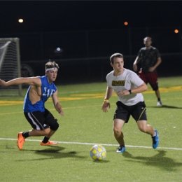 Students playing intramural soccer