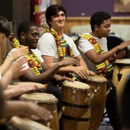 Students in Drum Ensemble performing for a convo
