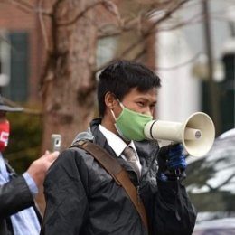 Eh Nay Thaw using bullhorn during protest
