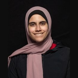 Student smiling at camera