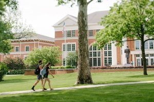 Students walking on the Centre College campus in front of Crounce Hall