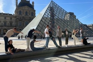 Centre students pose in front of the Louvre while abroad in France.