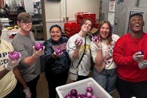 Centre students involved with the Food Recovery Network pose for a photo in the Campus Center kitchen.