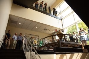 Community members viewing Foucault Pendulum dedication  in Olin Hall