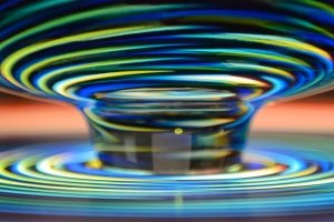 Light shines through brightly colored rings of glass created by Stephen Rolfe Powell.