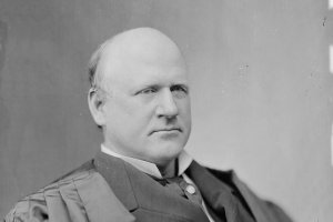 A black and white portrait of Justice John Marshall Harlan