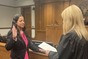 Maria Sanchez being sworn in by Susan Rodriguez.
