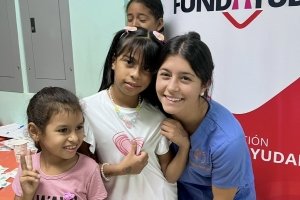 Nicole Limehouse with two of the children she helped treat.