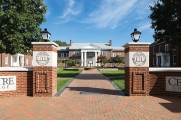 Bright spring photo of brick pathway and entry pillars