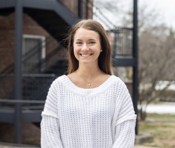 Student smiling at photographer