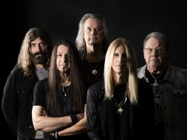 event_guess-who-2023.jpg Members of the band The Guess Who pose together with serious expressions