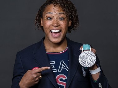 Olympic athlete Lauren Gibbs Pointing to her silver medal