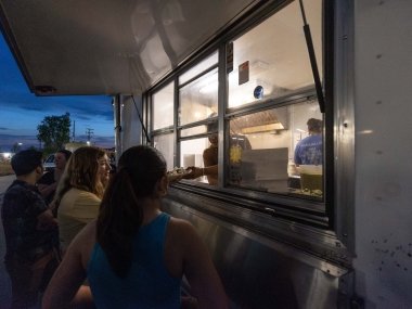 students getting food from local taco truck