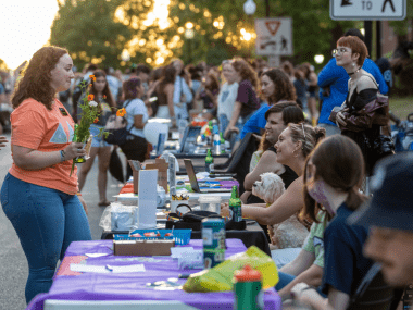 image of student talking to a table host at Expo