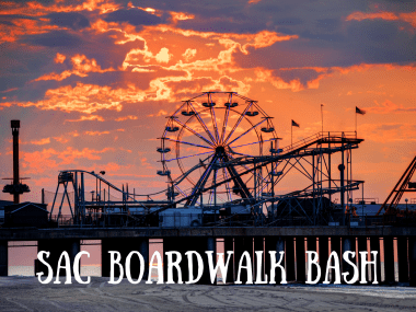 image of a beach boardwalk with carnival rides