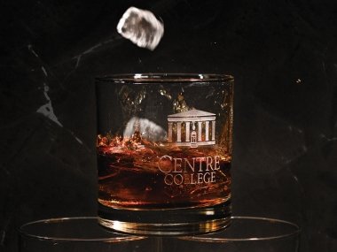Centre College rocks glass with bourbon and ice in it