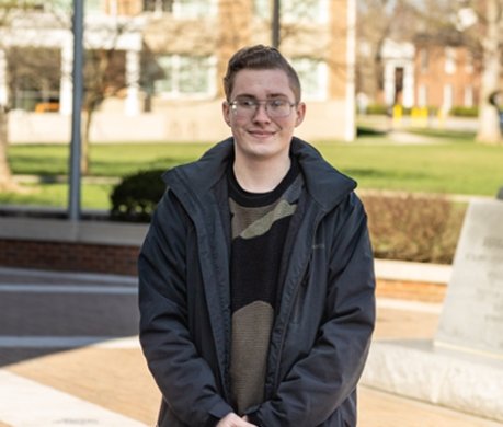 Student  standing outside on campus