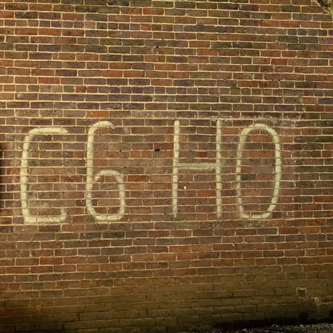 C6H0 painted on the side of a brick building