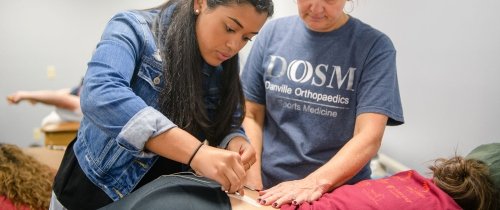 Student gaining hands-on experience in physical therapy