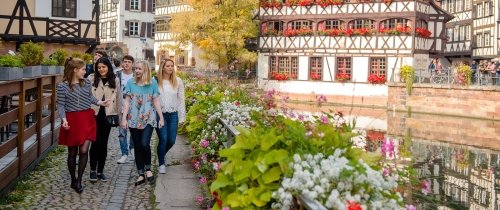 Students walking through garden in Strasbourg, France