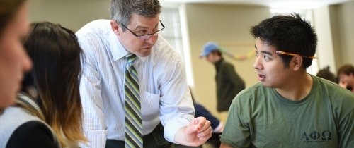 Students in discussion with philosophy professor