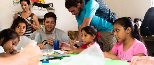 Student working with school children in Merida, Mexico