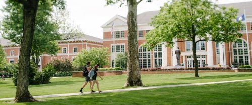 Students walking on the Centre College campus in front of Crounce Hall