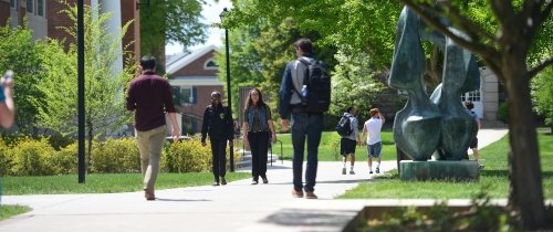 Diverse Centre students walking to class on a sunny day