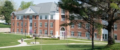 Student walking outside Northside Hall