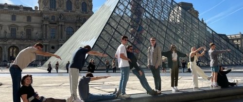 Centre students pose in front of the Louvre while abroad in France.
