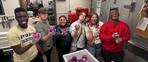 Centre students involved with the Food Recovery Network pose for a photo in the Campus Center kitchen.