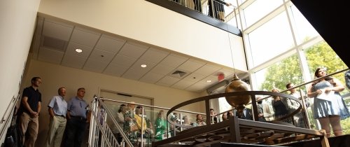 Community members viewing Foucault Pendulum dedication  in Olin Hall