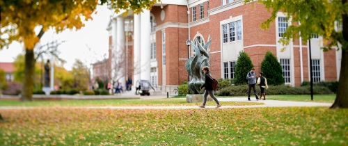 Centre College students walking outside on their way to class during fall