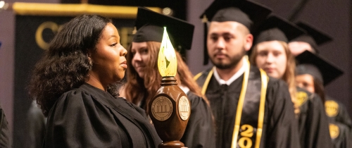 Centre students walking on stage at commencement ceremony