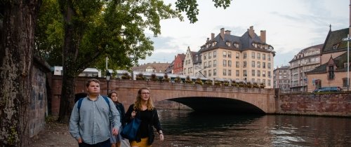 Students walking through Strasbourg historic buildings