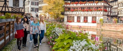 Students walking through Strasbourg historic buildings