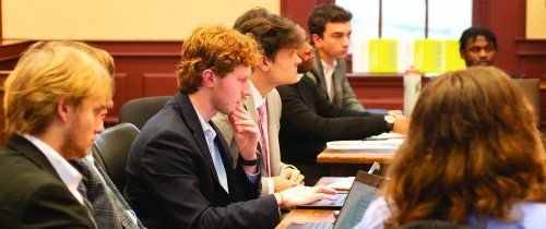 Students participating in mock trial in courthouse