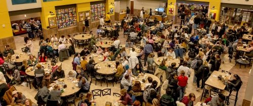 Aerial view of Cowan full of students at dining tables