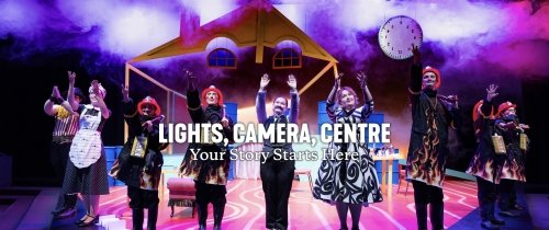 Lights, camera, Centre text on top of a theatre production photo