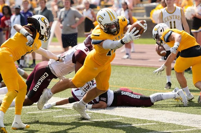 Centre football player diving for a touchdown