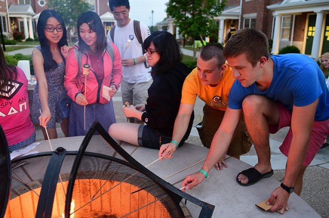 Students roasting marshmallows