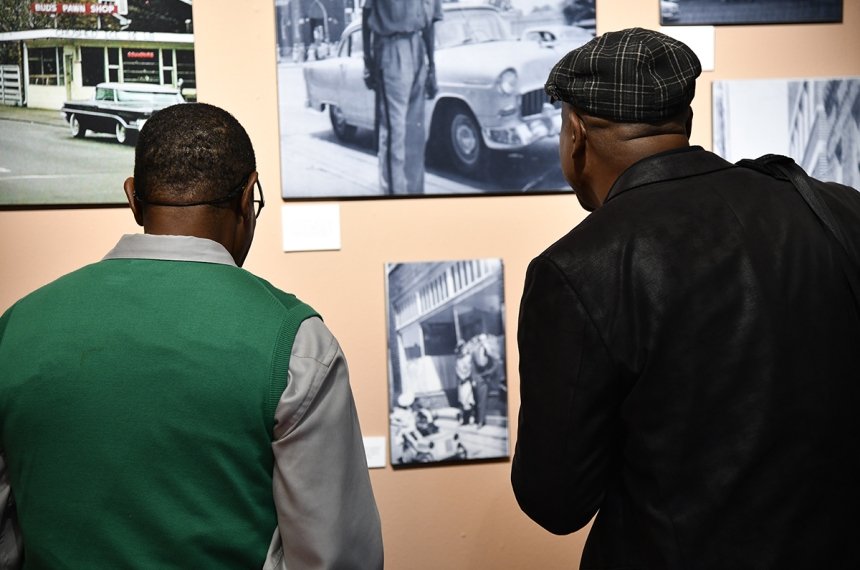 People viewing "We Were Here" exhibit